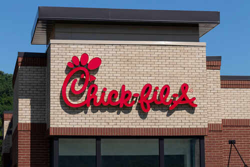 Chick-fil-A restaurant sign on a brick building