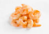 A pile of cooked shrimp on a white background