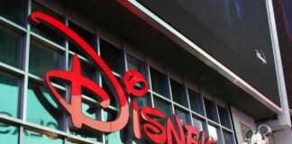 Disney sign on building with Mickey Mouse figure