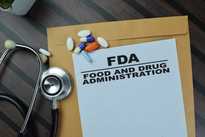 FDA document with pills and a stethoscope on a wooden surface