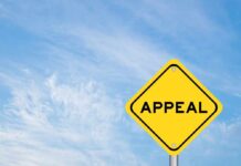 A yellow diamond-shaped sign with the word 'APPEAL' against a blue sky