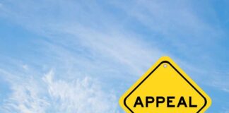 A yellow diamond-shaped sign with the word 'APPEAL' against a blue sky