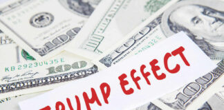 Text Trump Effect over hundred dollar bills