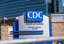 American Ebola Scare: Are We Safe? CDC building sign in front of structure.