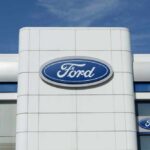 Ford-Carhartt Super Duty Stuns Detroit Exterior view of a Ford dealership with the logo prominently displayed