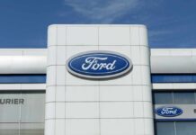 Exterior view of a Ford dealership with the logo prominently displayed