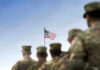 Army Drops Required Courses β Standards At Risk? Soldiers in uniform with American flag in background.