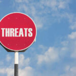 AI Exposes SHOCKING Threat To U.S. Defense Red sign with the word threats against sky