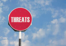 AI Exposes SHOCKING Threat To U.S. Defense Red sign with the word threats against sky