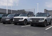 Row of compact SUVs parked at a dealership lot