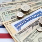 Various denominations of U.S. currency and a Social Security card on an American flag background