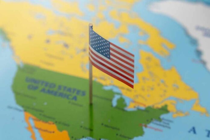 A,Miniature,United,States,Of,America,Flag,Stands,On,A