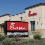 Chick-fil-A Faces Explosive Religious Dispute Exterior view of a Chick-fil-A restaurant with a promotional sign