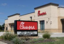 Chick-fil-A Faces Explosive Religious Dispute Exterior view of a Chick-fil-A restaurant with a promotional sign
