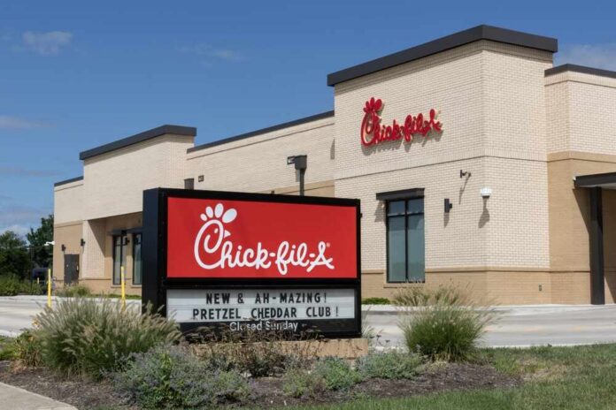 Avon,-,August,24,,2025:,Chick-fil-a,Chicken,Restaurant.,Despite,Ongoing Exterior view of a Chick-fil-A restaurant with a promotional sign