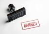 Banned rubber stamp and stamped text on paper