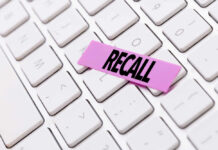 HUGE RECALL: 180K Vehicles Impacted A pink sticky note with the word 'RECALL' placed on a white keyboard