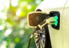 Electric car charging at a charging station.