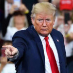 Man pointing at an audience during a speech.