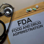 FDA Alarm: Mystery Shots Masquerade as Miracle? Stethoscope and medication on a folder labeled FDA