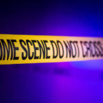 Yellow crime scene tape with the words 'CRIME SCENE DO NOT CROSS'