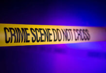 Festival Bloodbath Stuns American Town Yellow crime scene tape with the words 'CRIME SCENE DO NOT CROSS'
