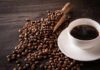 RECALL: Boiling Coffee Geysers? A cup of hot coffee next to spilled coffee beans and a wooden scoop