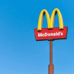 McDonald’s Brings Back The OG Pie — Fans Can’t Wait! McDonald's restaurant sign against a clear blue sky