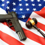Supreme Court Smacks Gun Rule Gun and gavel on a U.S. flag.