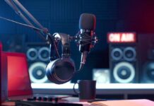 Close-up of a microphone and headphones in a podcast studio