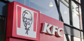 Exterior view of a KFC restaurant with its iconic logo