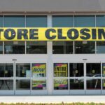 Billion-Dollar Buy, Now 175 Stores Axed Storefront with a large 'STORE CLOSING!' banner and sale signs