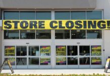 Billion-Dollar Buy, Now 175 Stores Axed Storefront with a large 'STORE CLOSING!' banner and sale signs