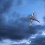Airliner ‘Hit’ Mystery Baffles FAA An airplane flying through a cloudy sky