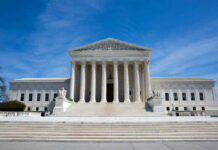 Supreme Court Draws Hard Border Line U.S. Supreme Court building under clear blue sky.