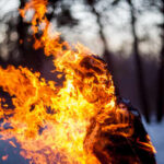 Teen Torches Man; Sentence Stuns NYC A silhouette of a person engulfed in flames in a forest setting