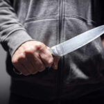 One Push, One Deadly Knife Murder A person holding a knife in a threatening manner