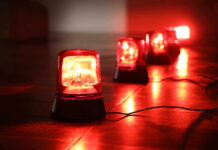 VIDEO: Mall Floor Vanishes After Blast Red emergency lights on dark floor, illuminating the area.