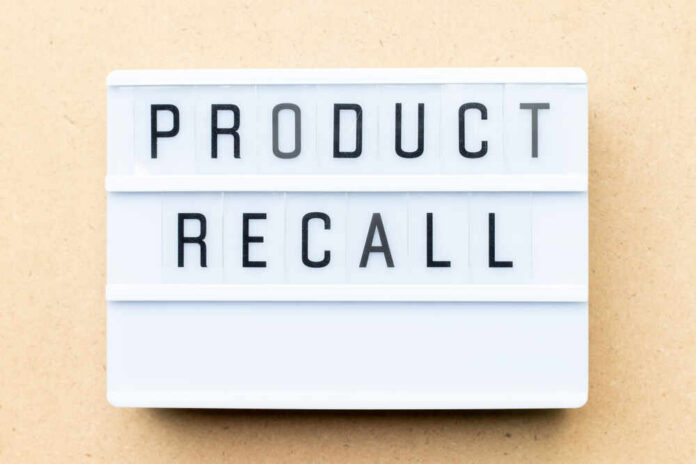 Lightbox sign with the words product recall on a beige background