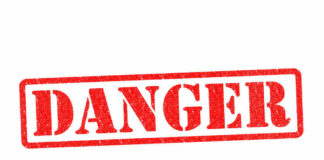 Red danger stamp on white background