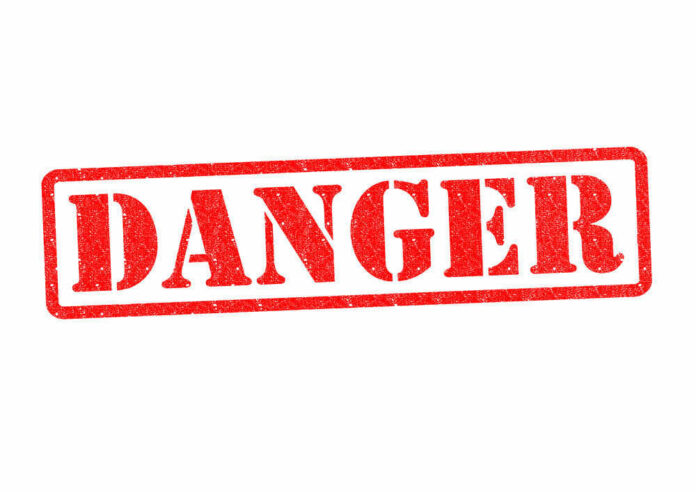 Red danger stamp on white background