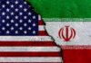 A cracked surface displaying the flags of the USA and Iran