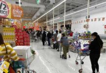 Gunfight Erupts Inside THIS Grocery Store Customers waiting in line at a supermarket checkout.