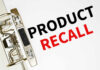 Recall Panic: Batteries Ignite Mid-Charge A binder clip holding a sheet of paper with the words 'PRODUCT RECALL' printed in bold letters