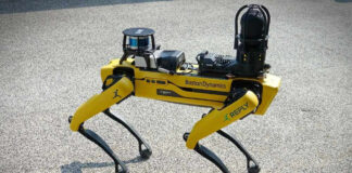 Fourlegged yellow robot dog on concrete ground