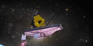 James Webb Space Telescope in orbit above Earth with a starry background