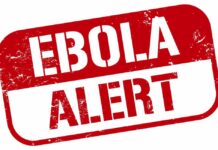 Ebola Evacuation Sparks Border Crackdown Ebola alert sign in bold red letters