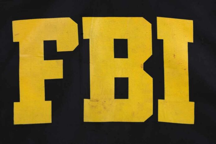 Fbi,Raid,Jacket,Black,Uniform,Background FBI logo displayed in large yellow letters on a black background