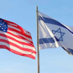 Mayor’s Power Fantasy Meets Federal Brick Wall American and Israeli flags waving against a clear sky.