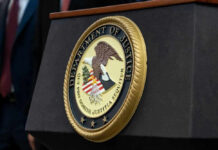 DOJ Backs Down — $722M Case Vanishes Department of Justice seal on a podium.